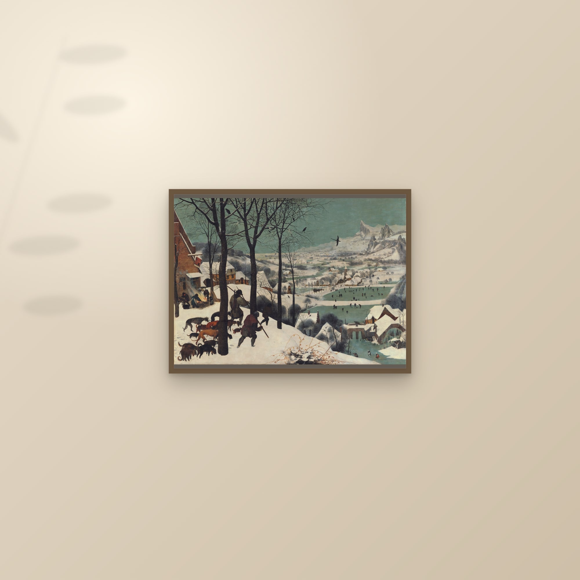 The Hunters in the Snow — Full-Bleed Edition — framed and styled on a sunlit wall