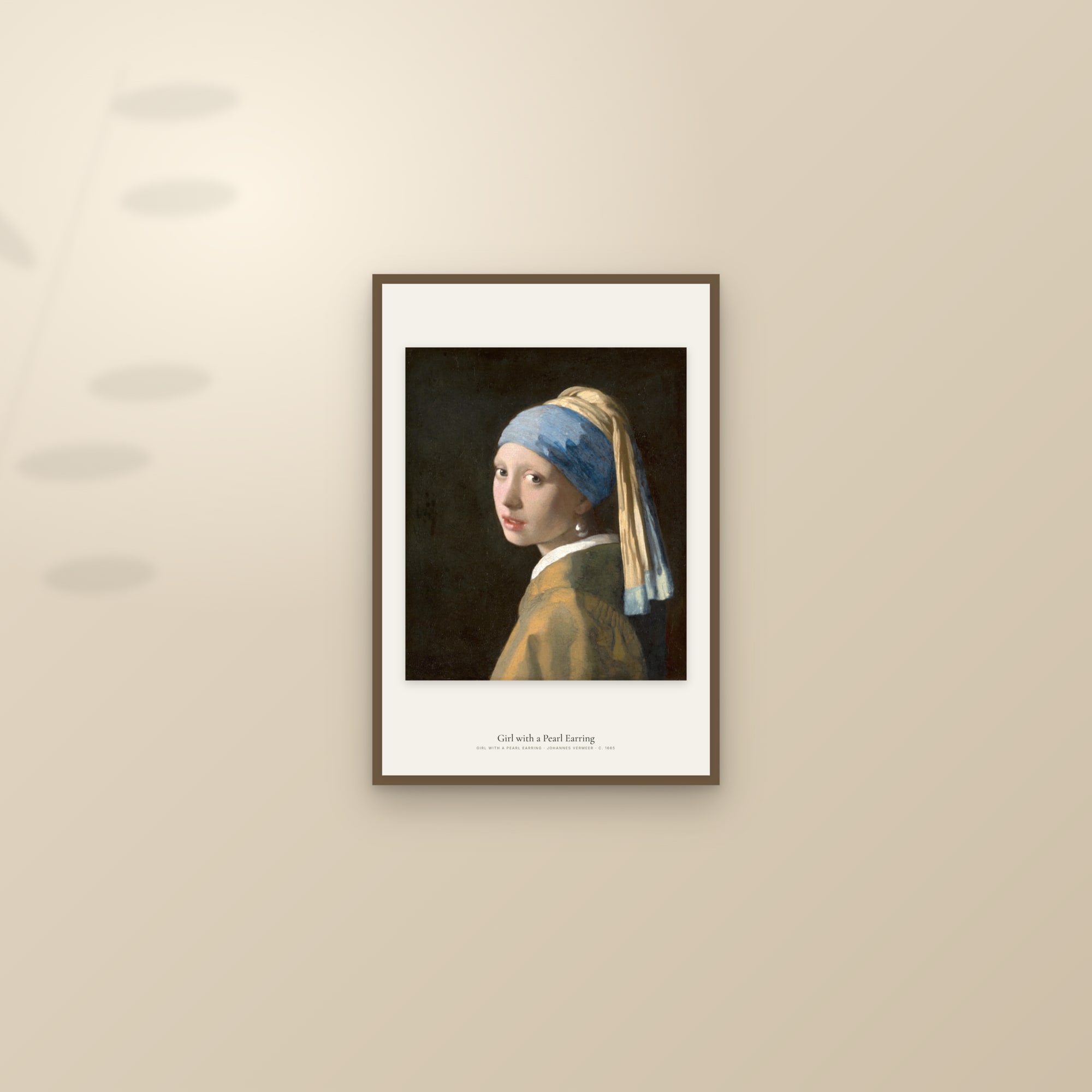 Framed print of Vermeer's Girl with a Pearl Earring on a sunlit wall