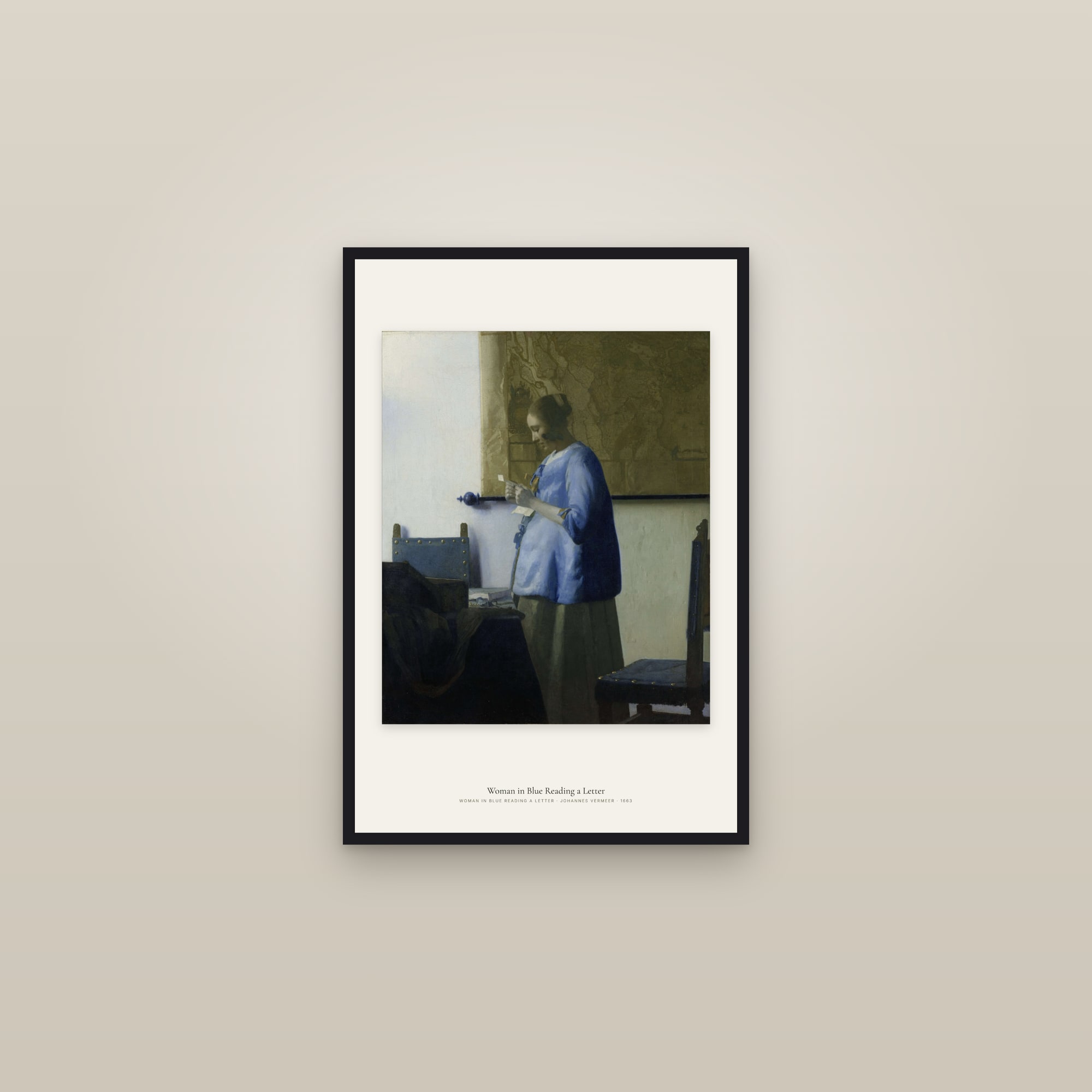 Woman in Blue Reading a Letter — framed in a gallery setting